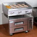 A Cooking Performance Group countertop gas griddle with food on top.