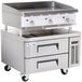 A Cooking Performance Group heavy-duty gas countertop griddle with refrigerated chef base.