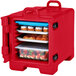 A red Cambro front loading tray and food pan carrier with food inside.