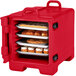 A red Cambro tray and food pan carrier filled with food on trays.