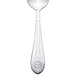 A Walco stainless steel teaspoon with an Art Deco design on the handle.