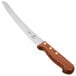 A Mercer Culinary Praxis bread knife with a wavy edge and rosewood handle.