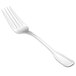 A silver Walco Luxor salad fork with a white background.