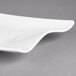 A Villeroy & Boch white porcelain rectangular platter on a gray surface.