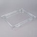 A Carlisle clear polycarbonate hinged lid with one notch on a plastic food pan.
