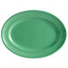 A white oval china platter with a green border.