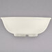 A white Thunder Group melamine salad bowl with a handle.