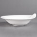 A white Villeroy & Boch porcelain deep bowl on a gray surface.