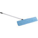 A blue Carlisle microfiber wet mop pad on a mop handle.
