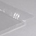 A clear plastic wrapper for American Metalcraft food display baskets.