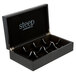 A black Steep by Bigelow tea chest with eight compartments.