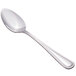 A Walco stainless steel serving spoon with a white background.