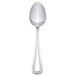 A Walco stainless steel tablespoon with a white handle.