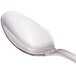 A close-up of a Walco Saville stainless steel iced tea spoon with a silver handle.