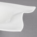 A Villeroy & Boch white porcelain deep bowl with a curved edge.