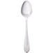 A white Walco stainless steel serving spoon with a silver rim and a black handle.