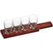 An Acopa mahogany flight paddle with Barbary tasting glasses on a wooden board.