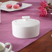 A white Villeroy & Boch Modern Grace porcelain sugar bowl with a lid on a table.