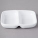 A white rectangular dish with two compartments.