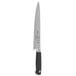 A Mercer Culinary Genesis chef knife with a black handle and silver blade in a white box with black text.