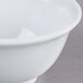 A white melamine rice bowl with a white rim.