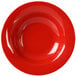 A red bowl with a wide rim on a white background.