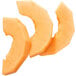 A group of orange slices of melon cut with a Robot Coupe 3/8" slicing disc.