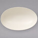 A white Villeroy & Boch oval bowl on a gray surface.