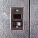 The metal door of a Norlake Kold Locker walk-in freezer with a digital temperature display.