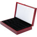 A red wooden Libbey knife display box with black foam inside.