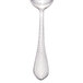 A Walco stainless steel dessert spoon with a textured handle.