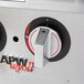 A close up of the knobs on an APW Wyott countertop gas range.