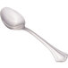 A close-up of a Walco stainless steel teaspoon with a silver handle and spoon.