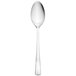 A Walco Freya stainless steel serving spoon with a white handle on a white background.