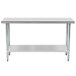 An Advance Tabco stainless steel work table with a galvanized metal shelf.