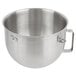 A silver stainless steel KitchenAid mixing bowl with a handle.