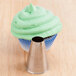 A cupcake with green frosting piped using an Ateco plain nozzle.