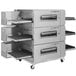 A large Lincoln Impinger conveyor oven with shelves.