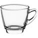 An Acopa clear glass coffee cup with a handle.