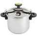 A stainless steel Monix pressure cooker with a lid and handle.
