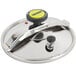 The silver stainless steel lid for a Monix pressure cooker with a yellow and black button.