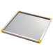 A white metal tray with yellow corners.