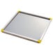A stainless steel Matfer Mousse Sheet with yellow corners.