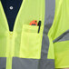 A man wearing a Cordova lime yellow safety vest with a pocket.