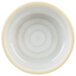 A white stackable bowl with a yellow rim.