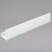 A white plastic Cambro Camshelving® ID tag with a long handle.