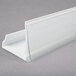 A white plastic profile for Cambro Camshelving® with a white plastic handle.