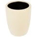 A beige stoneware cup with a black interior.