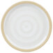 A white plate with a tan rim.