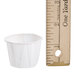A ruler measuring a Solo white paper souffle cup.